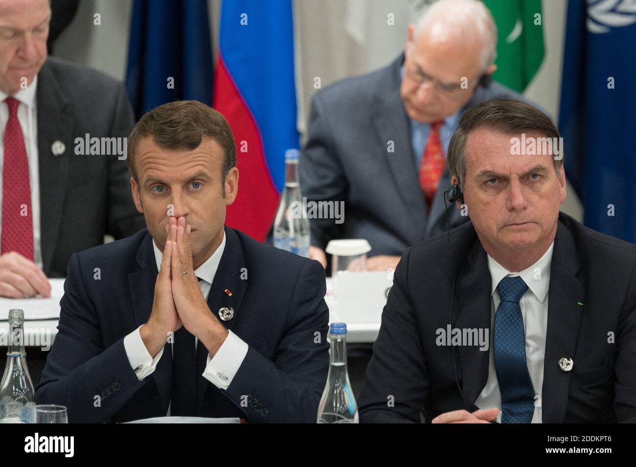 File photo dated June 28, 2019 of Emmanuel Macron and Jair Bolsonaro during a meeting on world economy at the first day of the G20 Summit in Osaka, Japan. On his official Facebook account, the Brazilian president endorsed, Saturday, August 24, an offensive comment against the wife of Emmanuel Macron. Under one of his posts about the sending of armed forces to fight fires, Bolsonaro reacted to a comment mocking the physique of the French First Lady - appearing on a disadvantageous photo - by comparing it to that of Michelle Bolsonaro (37), radiant on the day of the investiture of her husband. P Stock Photo