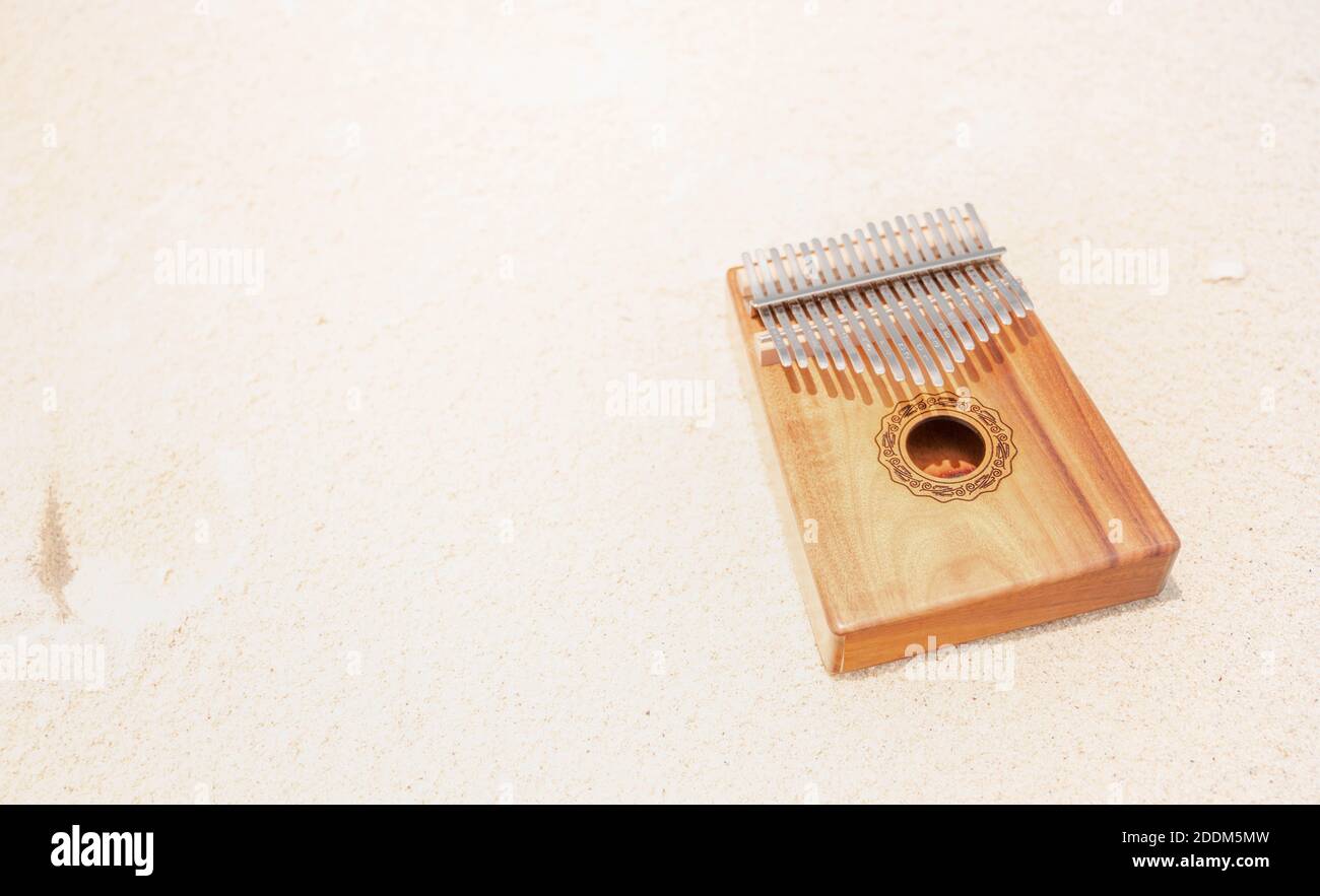 Kalimba or mbira is an African musical instrument. Kalimba made from wooden  board with metal, play on hands and plucking the tines with the thumbs. It  Stock Photo - Alamy