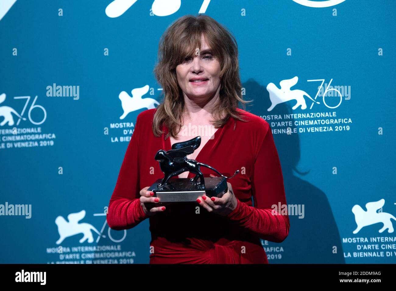 Emmanuelle Seigner poses with the Silver Lion Award - Grand Jury Prize