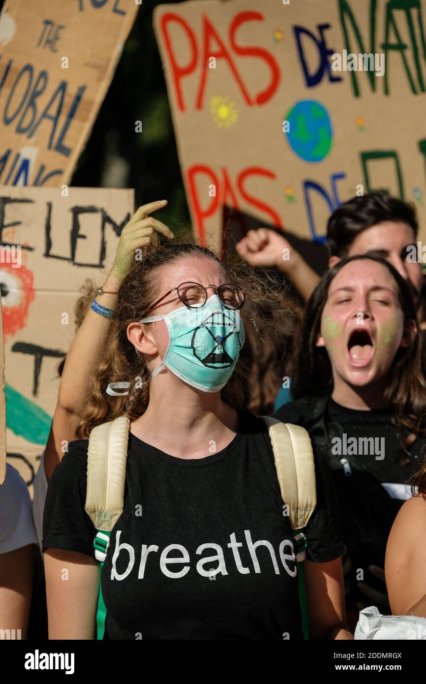 Shouting girl, with 'Extension Rebellion' (XR) logo mask and 'breathe' tee-shirt . Young climate protesters march past holding many signs with the message to defend the planet and against climate change. This is another day of a global climate strike to denounce climate inaction and demand social justice in Toulouse, France. on September 20, 2019. Photo by Patrick Batard/ABACAPRESS.COM Stock Photo