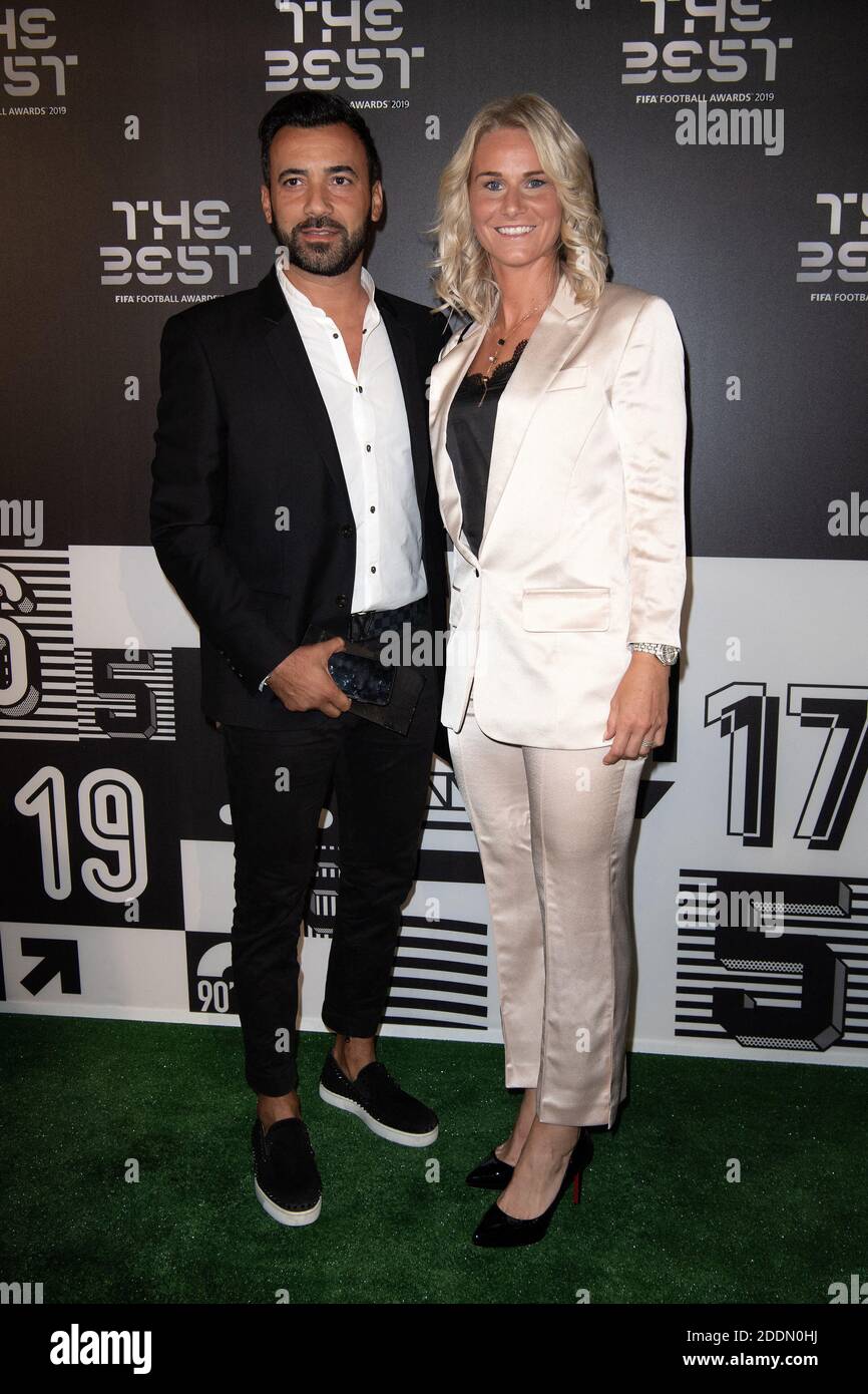 The FIFA FIFPro WomenâÂ€Â™s World11 Winner Amandine Henry of Olympique  Lyonnaise and France with his partner Karim attend the green carpet prior  to The Best FIFA Football Awards 2019 at the Teatro