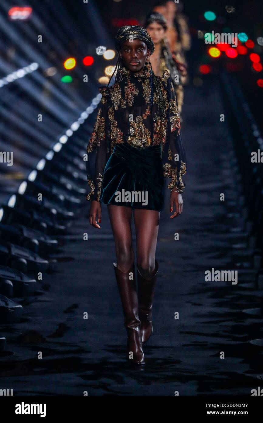 A model walks the runway during the Saint Laurent Ready to Wear  Spring/Summer 2020 fashion show as part of Paris Fashion Week on September  24, 2019 in Paris, France. Photo by Alain