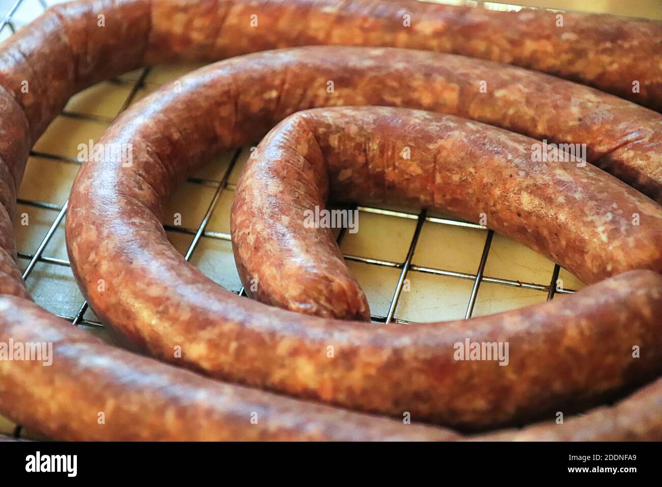 Closeup of raw coiled ham and garlic sausage Stock Photo