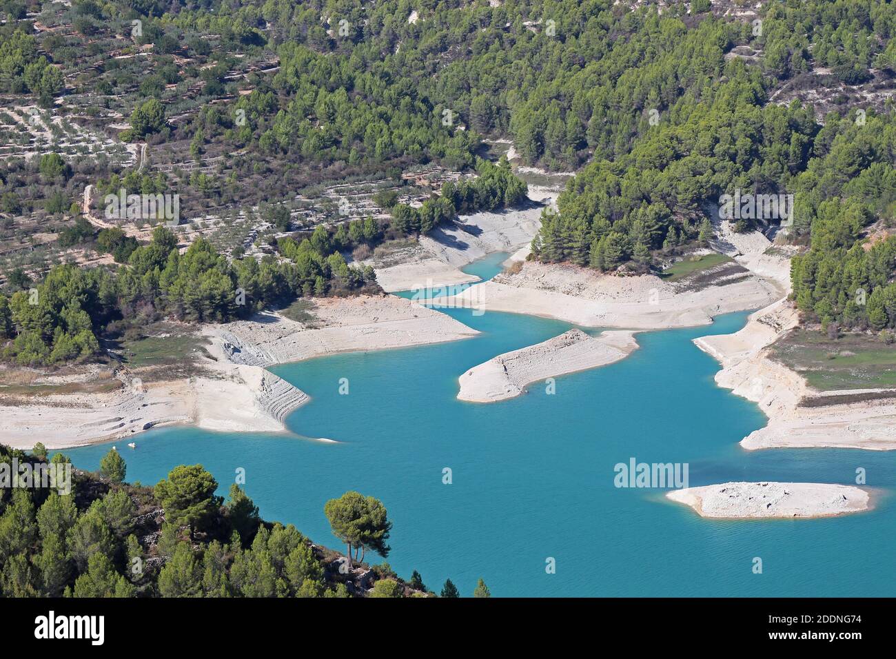 As late as October in 2014 the reservoir of Guadalest was seriously low in its water levels due to a prolonged period of dry weather. Stock Photo