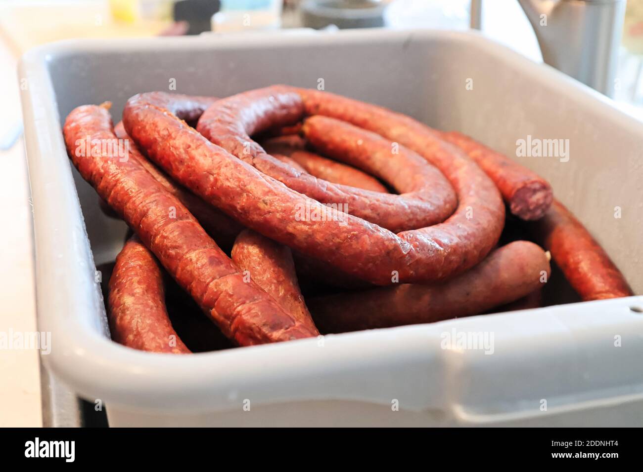 Coils of finished sausage in a meat processing tubs Stock Photo Alamy