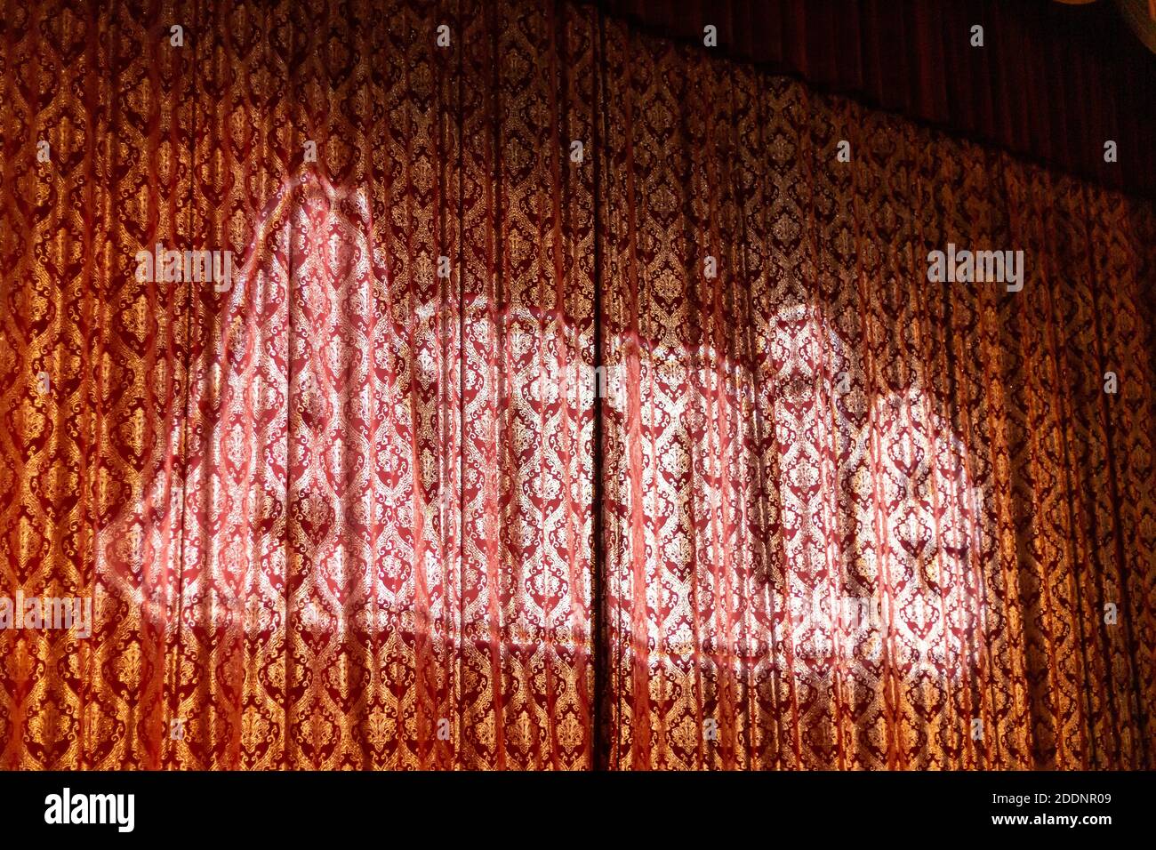 'Annie' is projected onto the stage curtain at the Embassy Theatre prior to a performance of the musical in Fort Wayne, Indiana, USA. Stock Photo