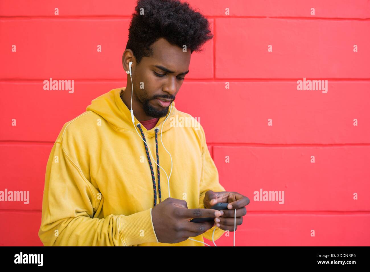 Afro man using his mobile phone. Stock Photo