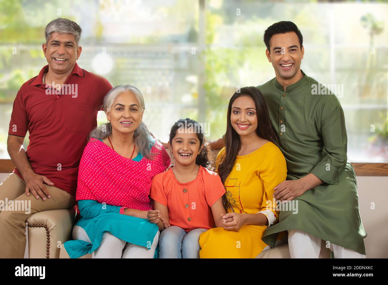 Indian group joint family sitting hires stock photography and images