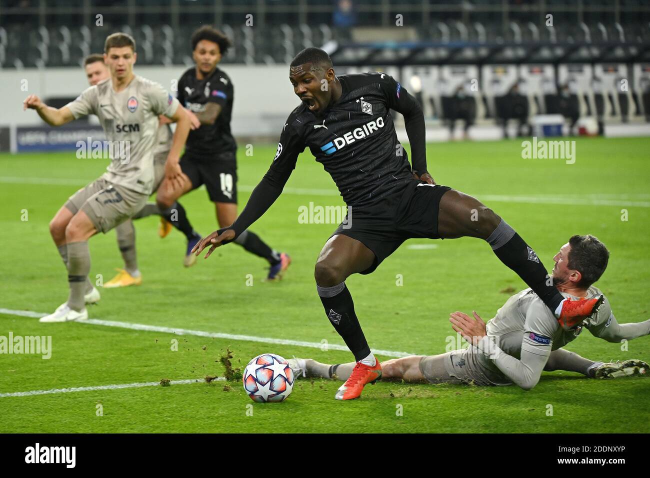 Moenchengladbach, Germany. 25th Nov, 2020. Marcus Thuram(Front) of Moenchengladbach competes during the UEFA Champions League Group B football match between Borussia Moenchangladbach and FC Shakhtar Donetsk in Moenchangladbach, Germany, Nov. 25, 2020. Credit: Ulrich Hufnagel/Xinhua/Alamy Live News Stock Photo
