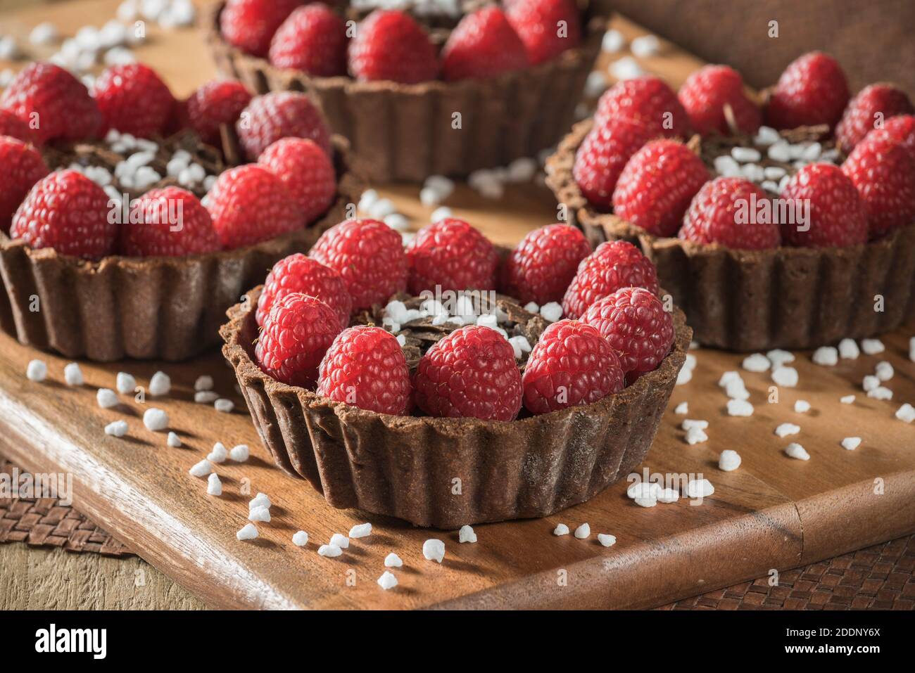 Chocolate and raspberry tarts Stock Photo