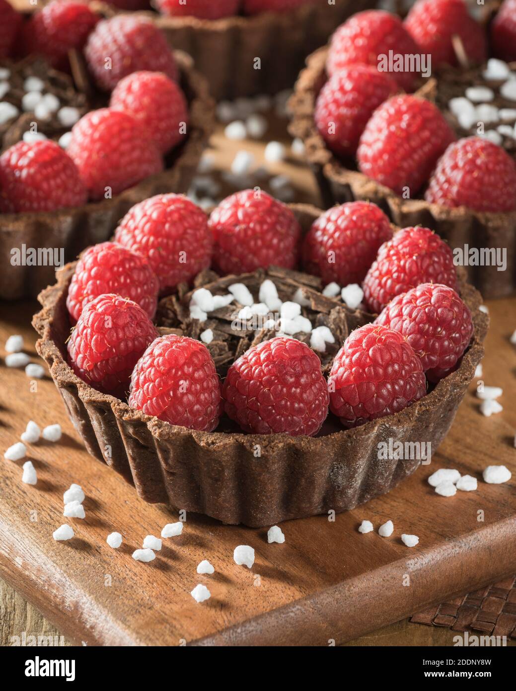 Chocolate and raspberry tarts Stock Photo