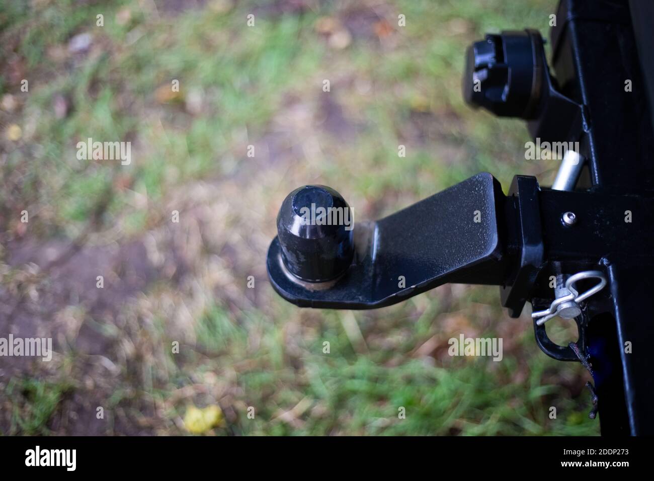 iron hitch for a caravan on the rear bumper of the car. Stock Photo
