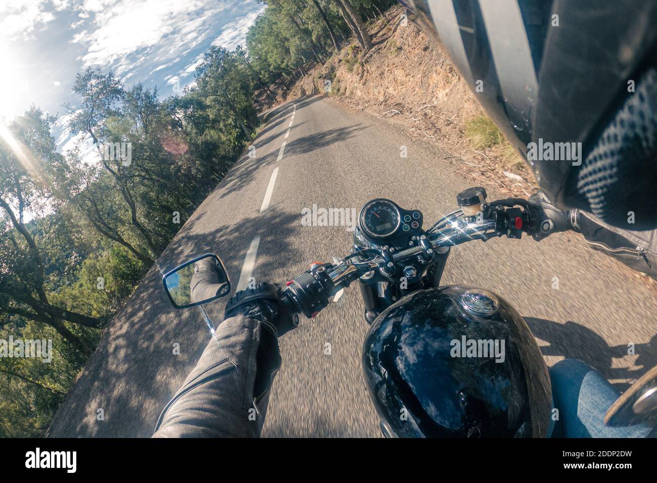 Riding a retro old black motorbike rider point of view on a winding ...