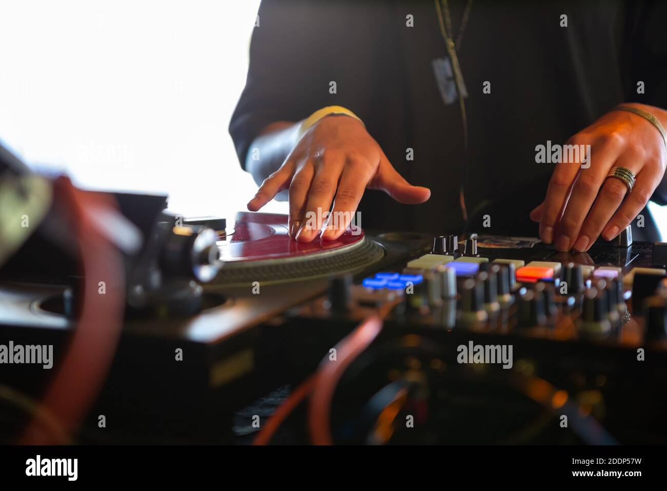 Dj girl scratches vinyl record with music on hip hop battle event in