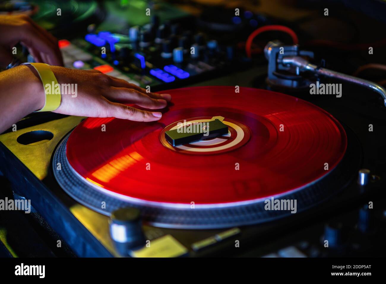 Dj girl scratches vinyl record with music on hip hop party in   female disc jockey scratching records on   djs setup for Stock Photo - Alamy