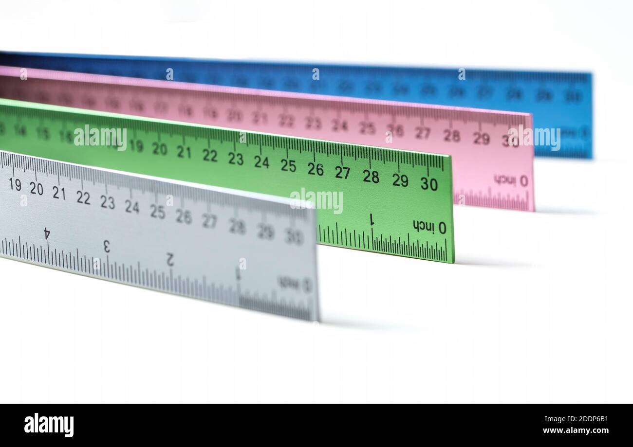 Colorful Metal rulers on white tabletop product Stock Photo - Alamy