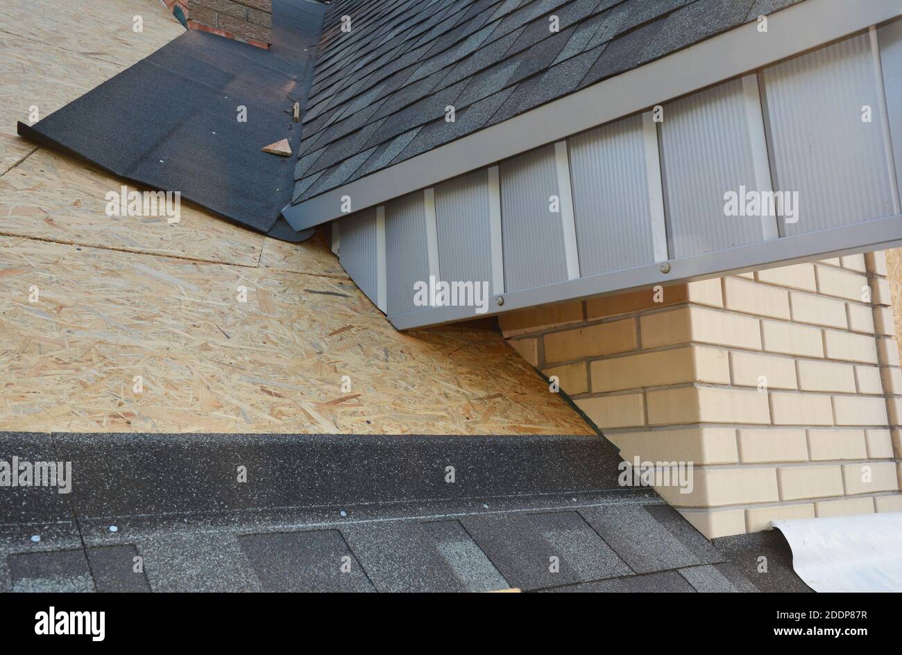 A close-up on unfinished attic roofing construction with fascia board