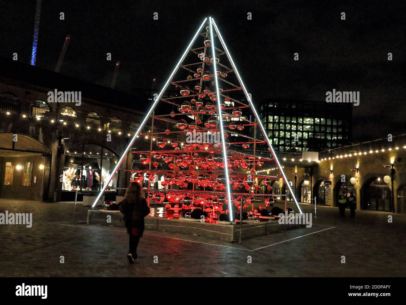 The Terrarium Tree lit at night in Coal Drops Yard.King's Cross, London
