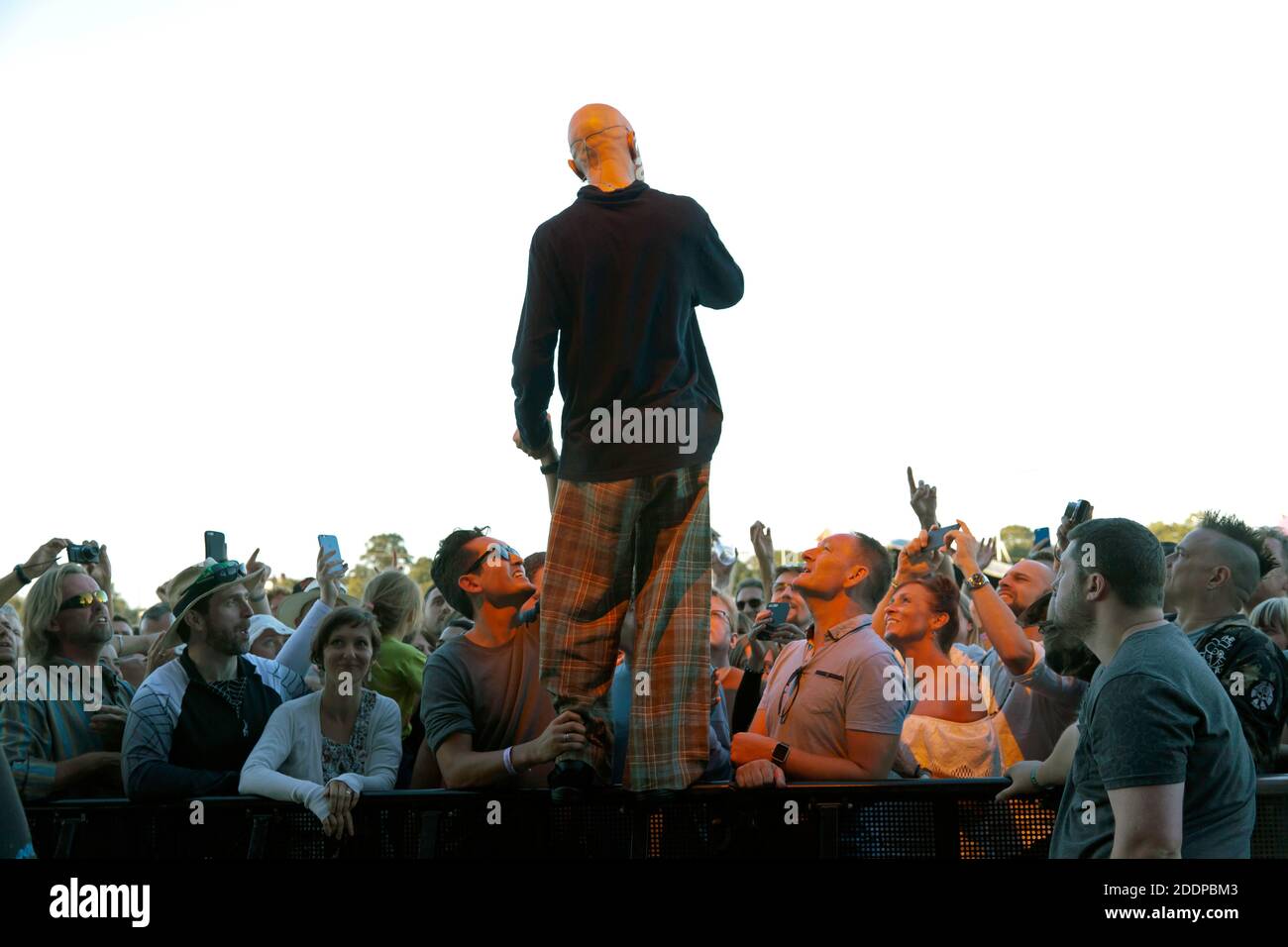 Tim Booth, lead singer from the band James, standing up and facing the crowd line,  during their set on the Main Stage at the 2016 OnBlackheath Music Festival Stock Photo