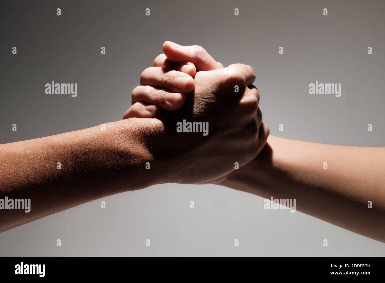 Crossed hands on a white background Stock Photo