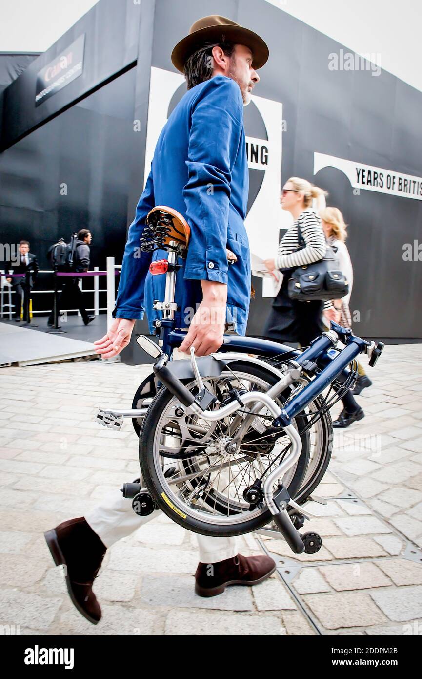 Fashion stylists, photographers, models, journalists and other fashion workers make their way to the catwalk shows during London Fashion Week. Stock Photo