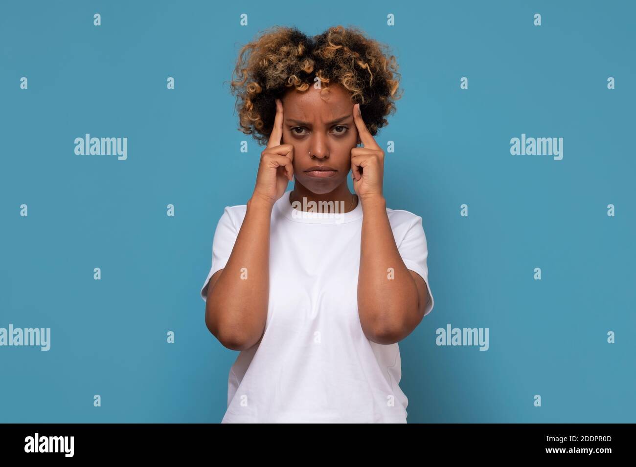 Woman fingers on temples hi-res stock photography and images - Alamy