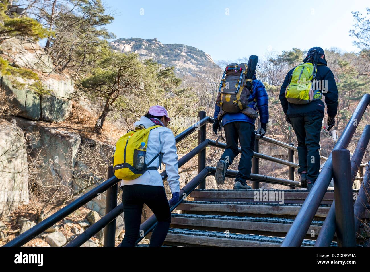 Korean hikers climbing the rock at the Bukhansan Mountain National park