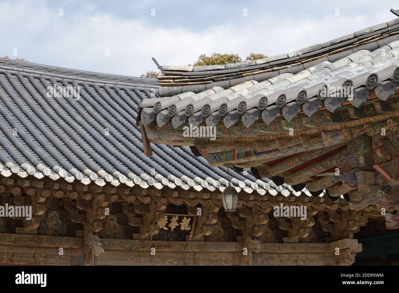 Roofs of Tongdosa Temple near Yangsan, South Gyeongsang Province, Korea. Inscription: 龍華殿 'Maitreya Hall' Stock Photo