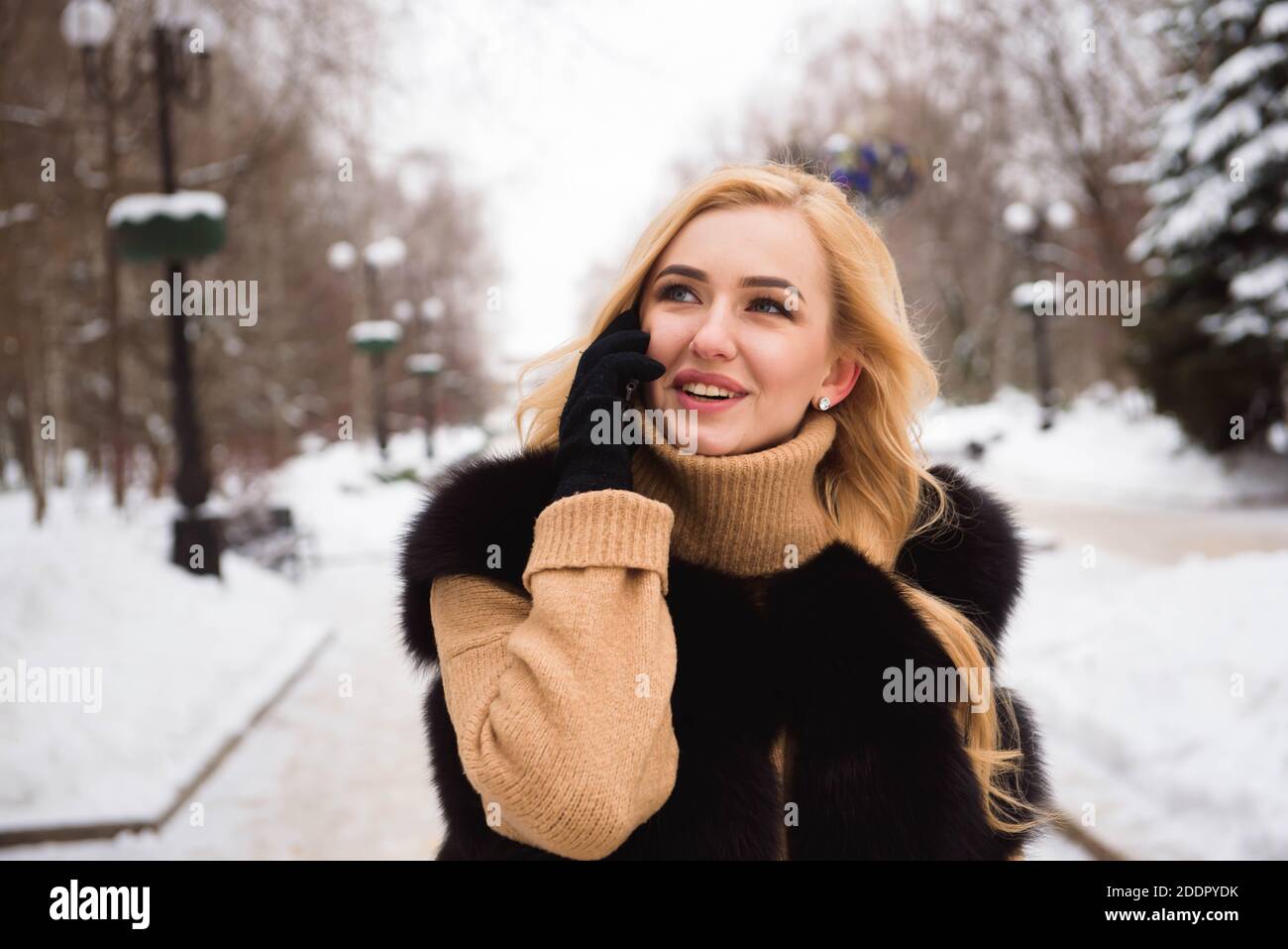 Outdoor close up photo of young beautiful happy smiling girl walking on ...