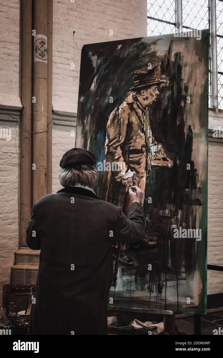 Deventer, Netherlands, December 15, 2018: Artist busy painting a character from the Charles Dickens books Stock Photo
