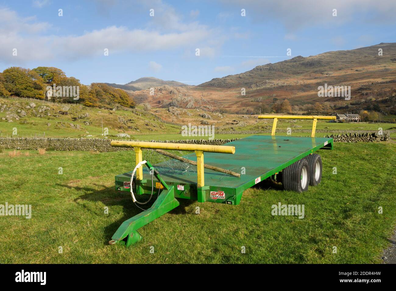 A double axle farm trailer in a field in the Duddon Valley in the Lake District National Park, Cumbria, England. Stock Photo