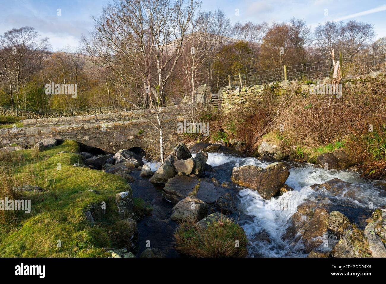 A stone bridge over Long House Gill in the Duddon Valley in the Lake District National Park, Cumbria, England. Stock Photo