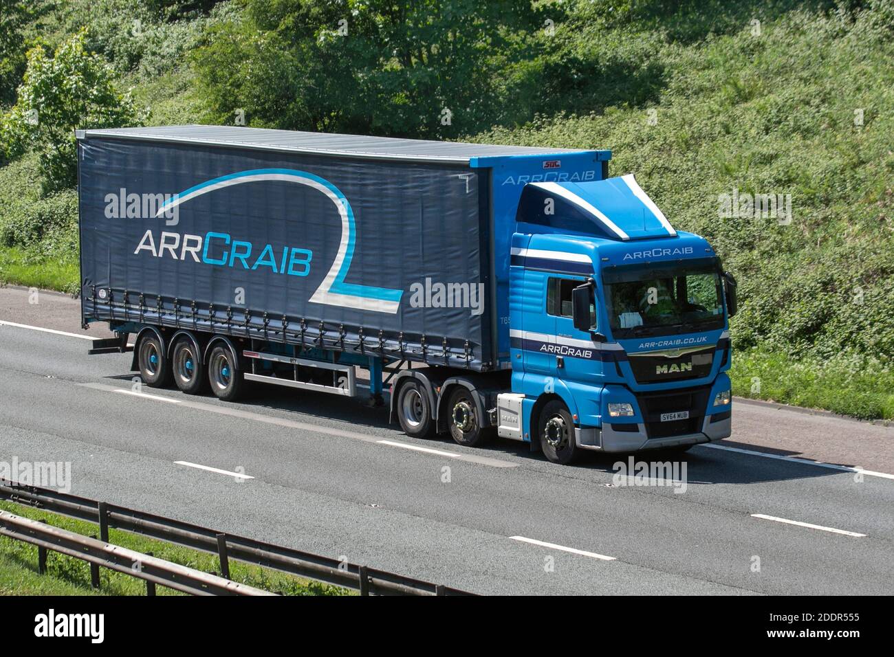 ArrCraib Haulage delivery trucks, lorry, heavy-duty vehicles, transportation, blue truck, cargo carrier, MAN vehicle, European commercial transport industry HGV, M6 at Manchester, UK Stock Photo