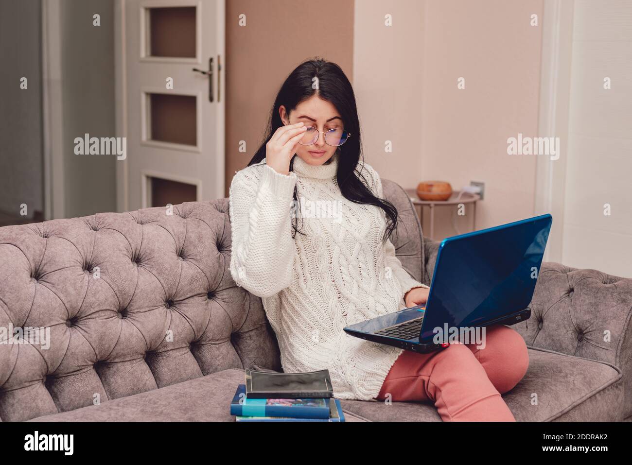 Young woman working remotely during quarantine Stock Photo