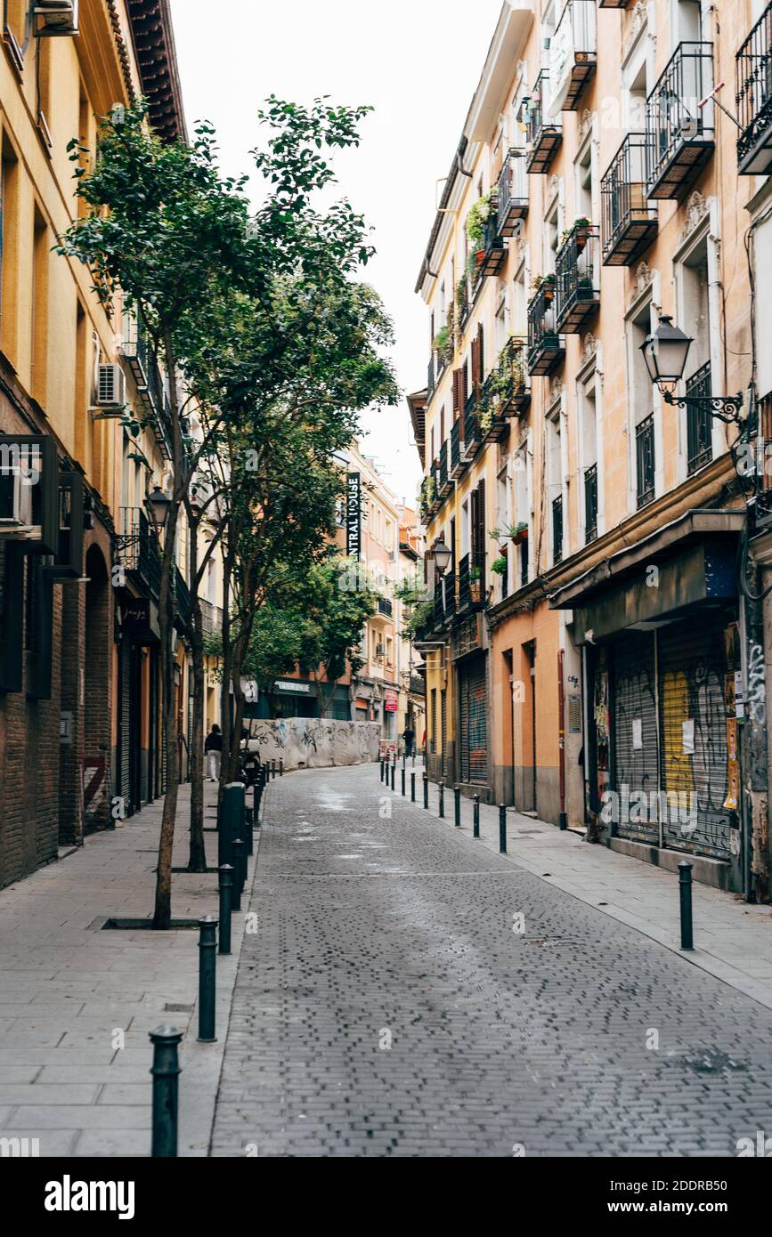 Madrid, Spain - 4th October, 2020: Traditional street in Embajadores area in Lavapies quarter in central Madrid. Lavapies is one of the coolest neighb Stock Photo
