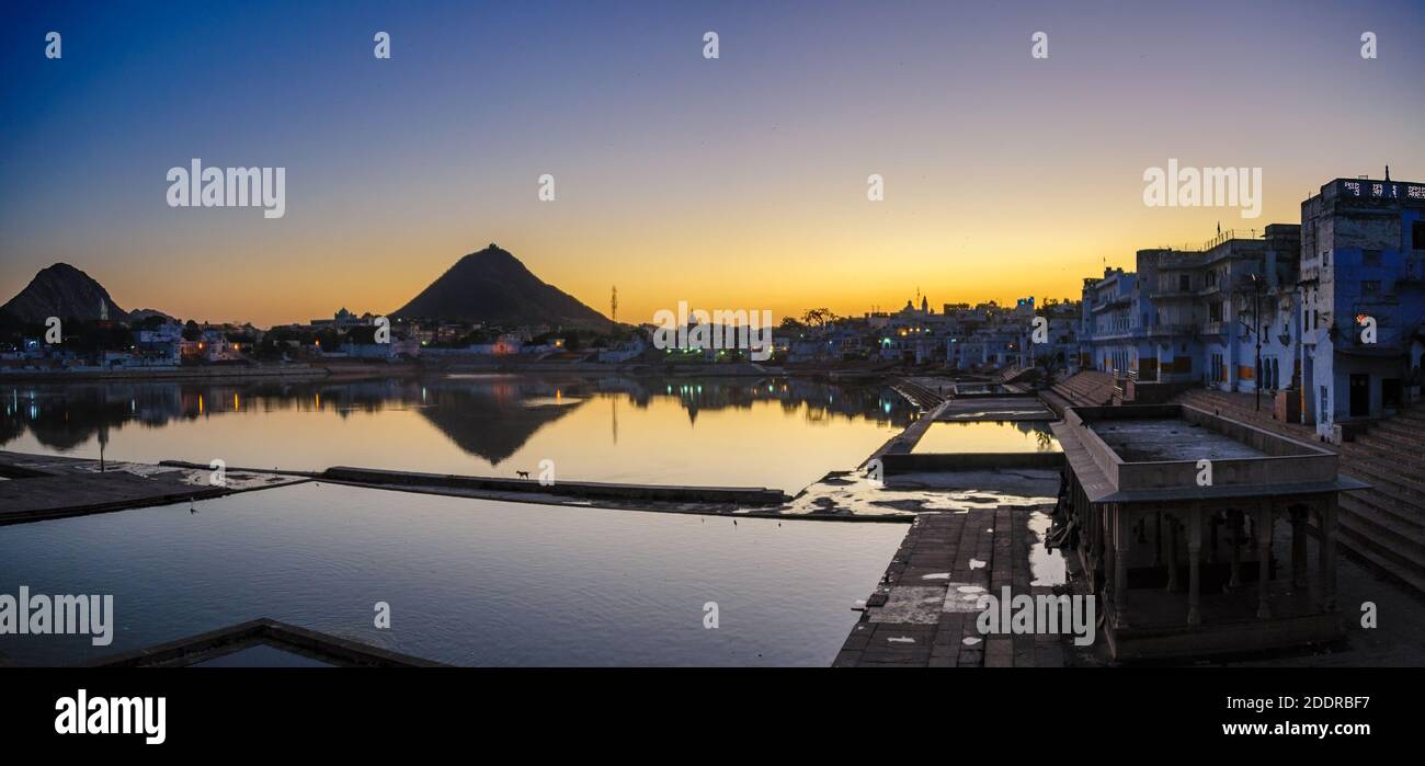 Sunset at Pushkar Lake, located in the town of Pushkar in Ajmer district of the Rajasthan state of western India. Pushkar Lake is a sacred lake of the Stock Photo
