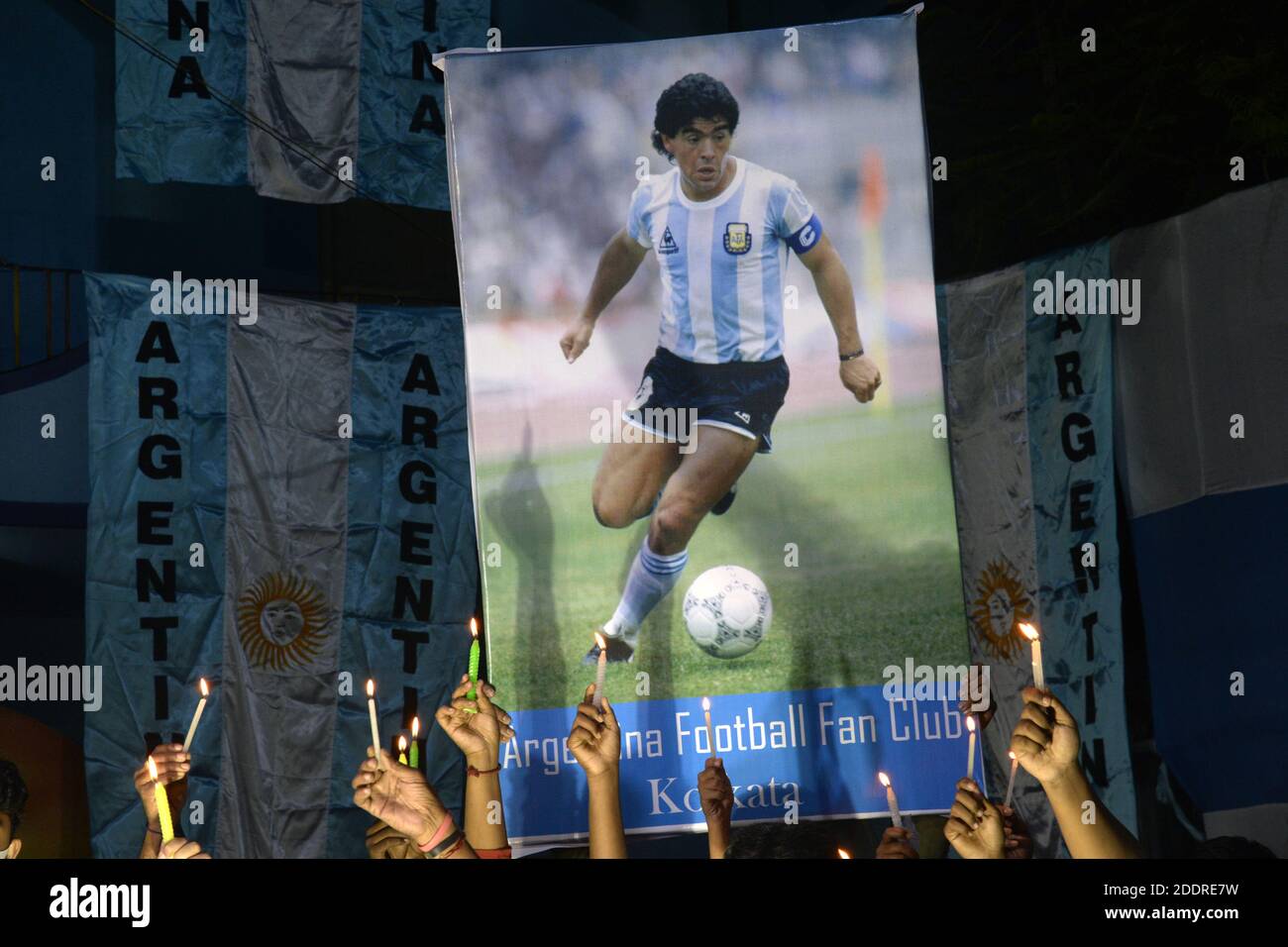 Kolkata, India. 26th Nov, 2020. Maradona Fan club members hold candle to pay homage to Maradona. (Photo by Ved Prakash/Pacific Press) Credit: Pacific Press Media Production Corp./Alamy Live News Stock Photo
