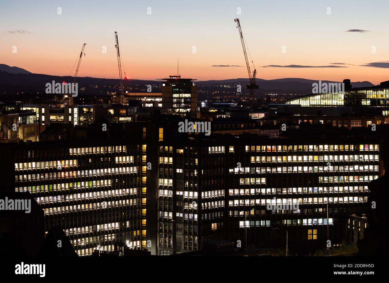 Office buildings with lights on at night in Edinburgh, Scotland. UK Stock Photo