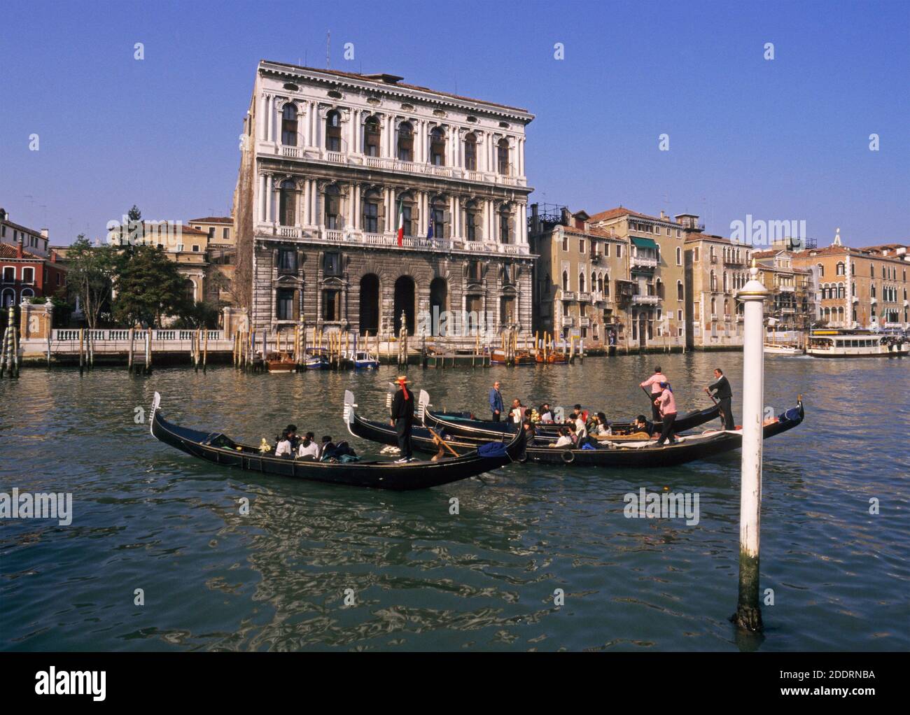 gondolas on Canal Grande and Ca Corner palace Venice Italy Stock Photo