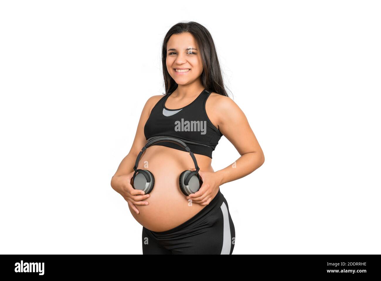 Pregnant Woman Playing Music To Her Baby With Headphones On Belly Stock  Photo, Picture and Royalty Free Image. Image 116985232.