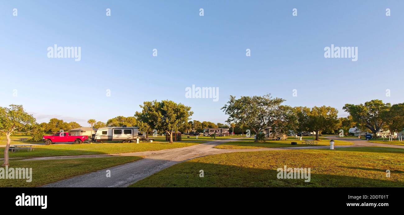 Flamingo Campground; motorhomes, grassy campsites, many empty, trees, golden hour light, recreation, Florida; Everglades National Park; Flamingo; FL; Stock Photo