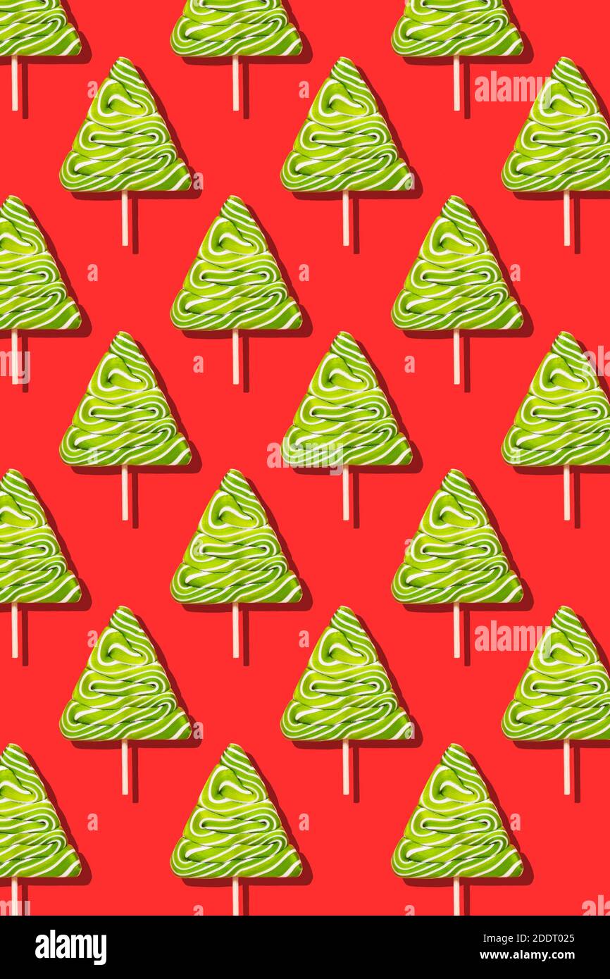 Seamless christmas pattern from sweet tree on red background. Stock Photo