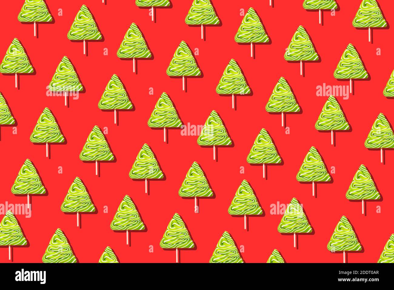 Seamless christmas pattern from sweet tree on red background. Stock Photo