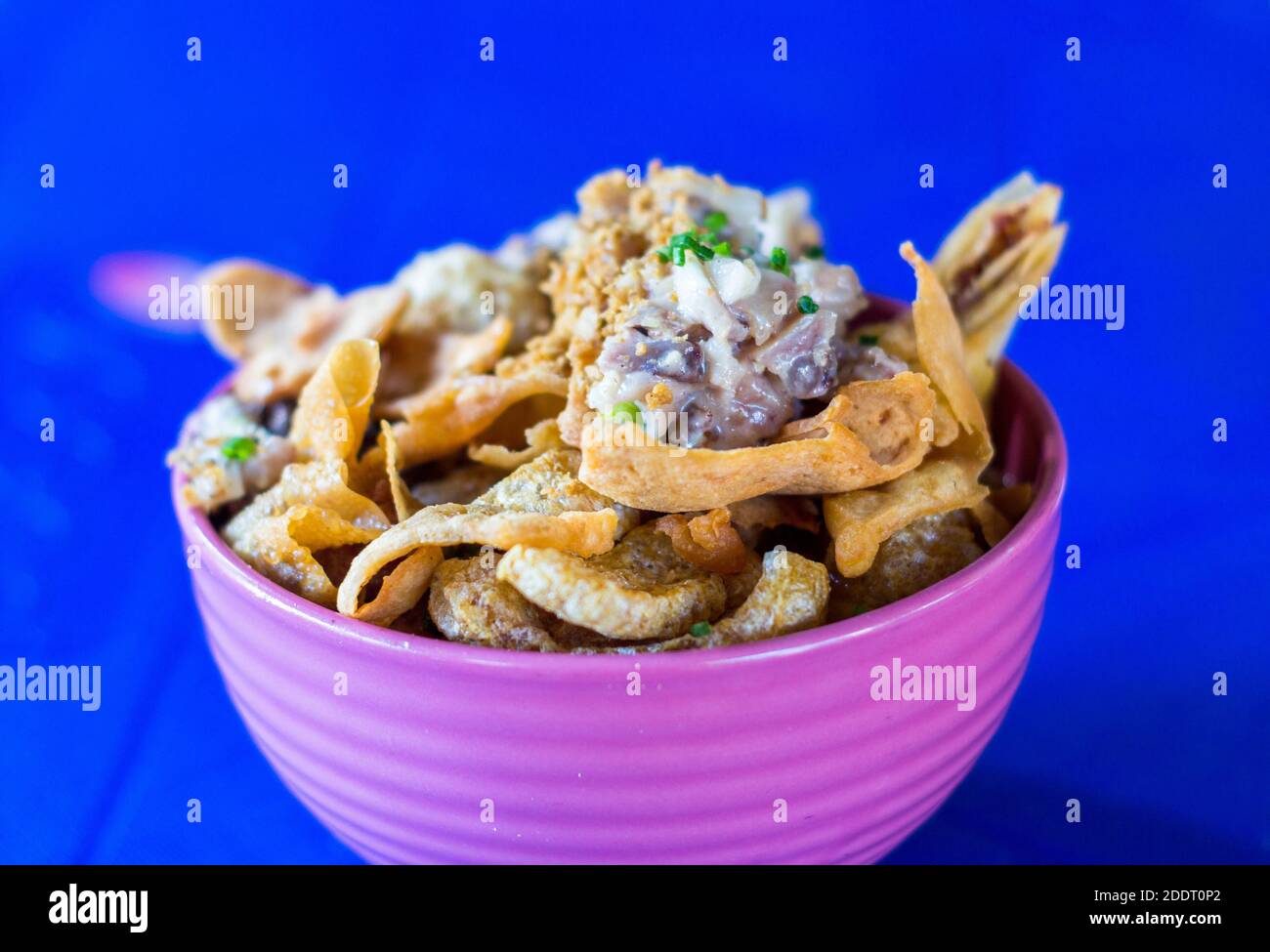 An overloaded noodle dish locally called lomi brimming with toppings at ...