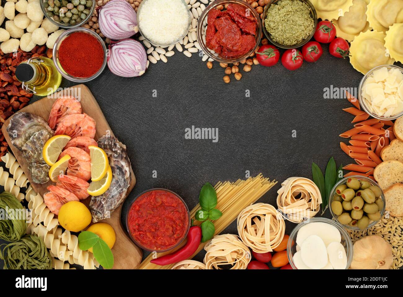 https://c8.alamy.com/comp/2DDT1JC/mediterranean-food-ingredients-for-a-healthy-diet-with-seafood-pasta-sauces-vegetables-herbs-legumes-olive-oil-cheeses-border-on-slate-2DDT1JC.jpg