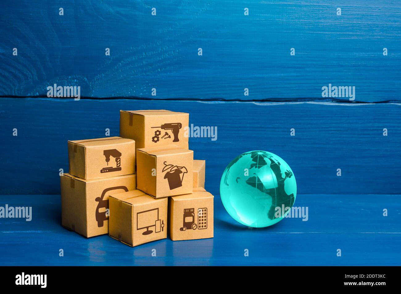Glass globe and a bunch of boxes. Global business and world trade. Distribution of goods, import and export of products. Freight shipping delivery to Stock Photo