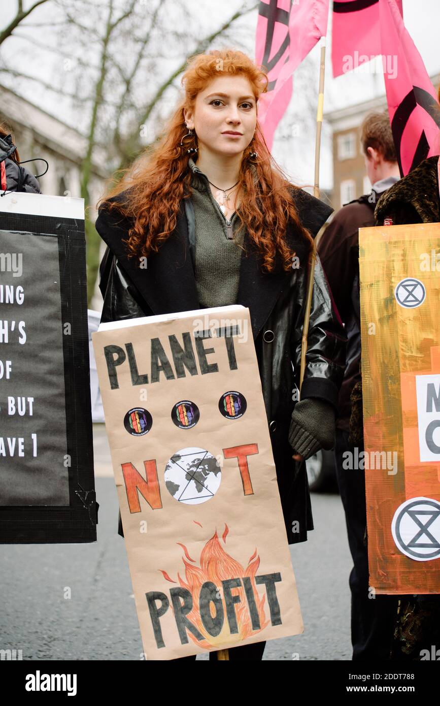 London, United Kingdom - February 15, 2020: Extinction Rebellion  outside London Fashion Week to raise awareness on the climate impact  of fashion Stock Photo