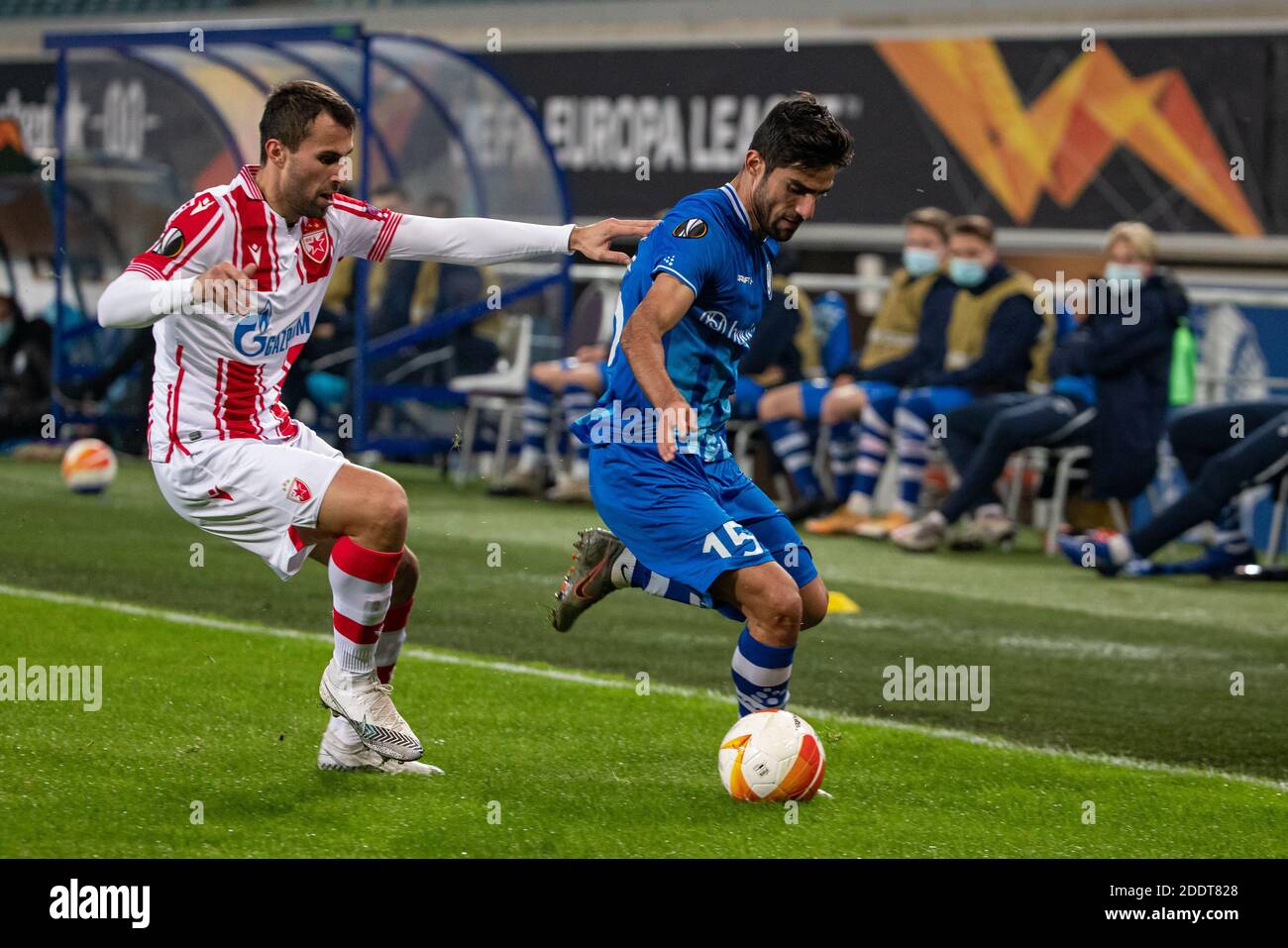 Belgrade's Milan Gajic and Gent's Milad Mohammadi fight for the ball during a soccer match between Belgian club KAA Gent and Serbian team Crvena Zvezd Stock Photo