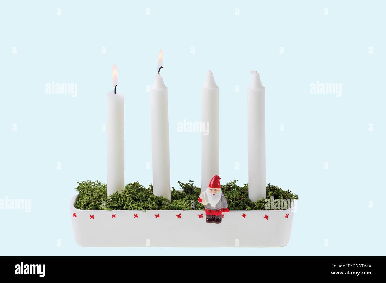 Close up view of traditional advent candlestick with one lighted candle  symbolizing second advent isolated on blue background Stock Photo - Alamy