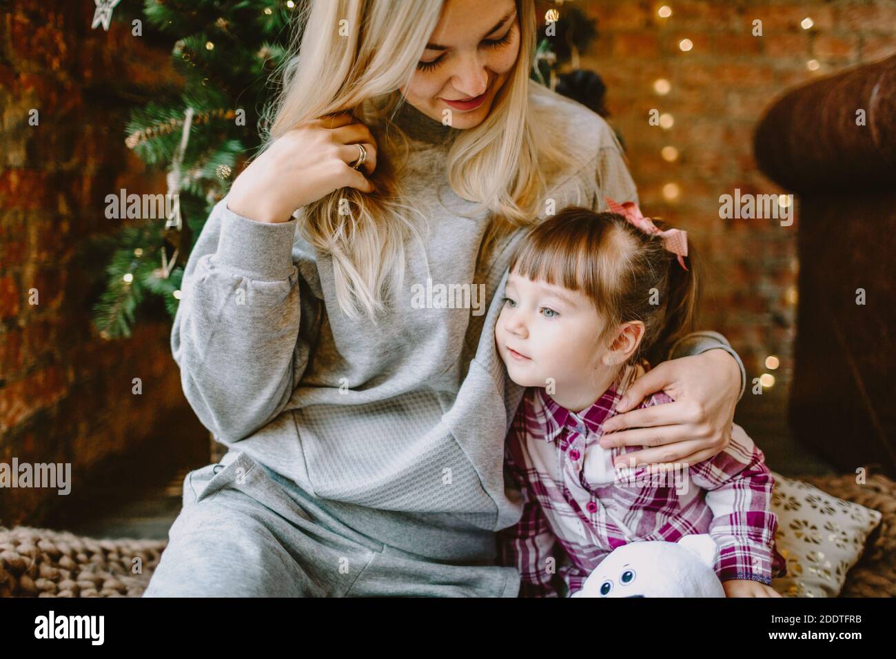 November 23, 2020. Anapa, Russia. Yong girl with mother in Christmas interior. Holiday winter time. Stock Photo